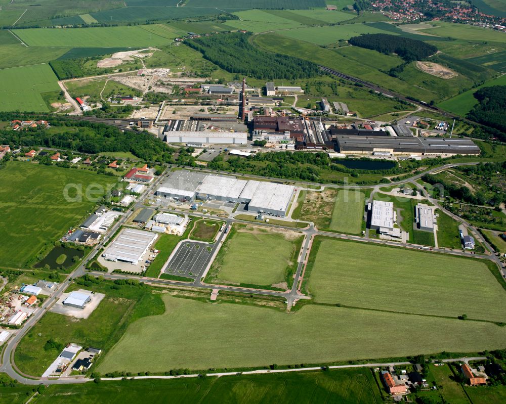 Drübeck from the bird's eye view: Industrial and commercial area on the edge of agricultural fields and fields in Drübeck in the state Saxony-Anhalt, Germany
