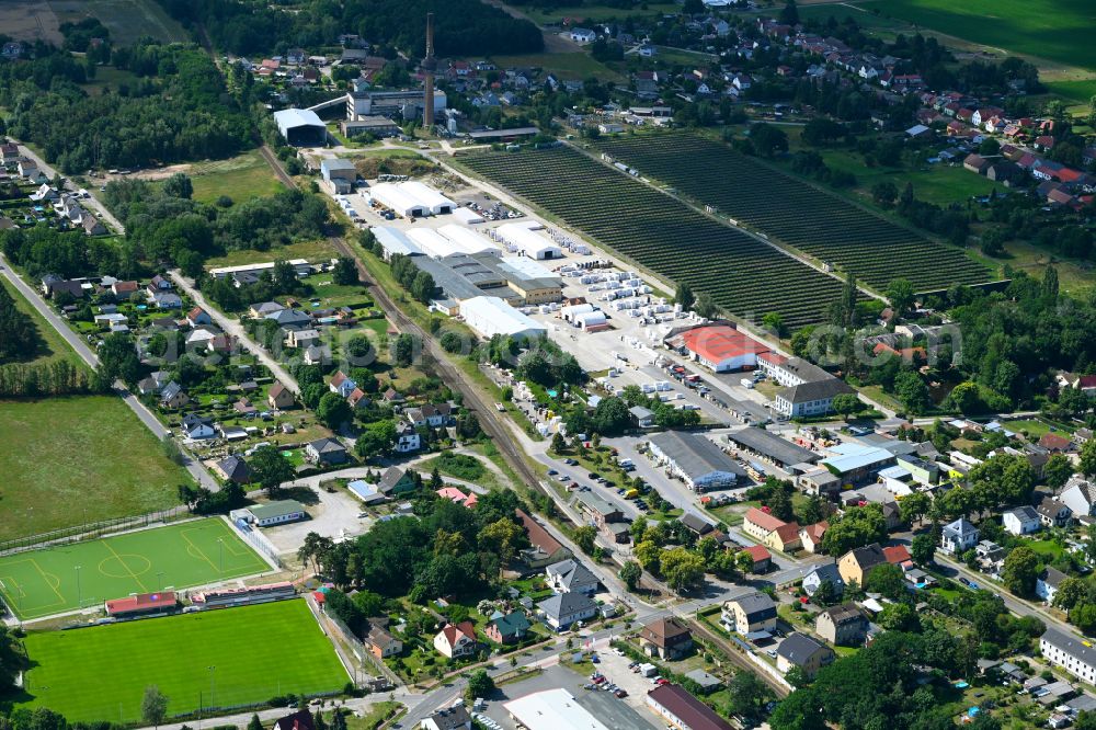 Klosterfelde from the bird's eye view: Industrial and commercial area on the edge of agricultural fields and fields on street Beusterstrasse in Klosterfelde in the state Brandenburg, Germany