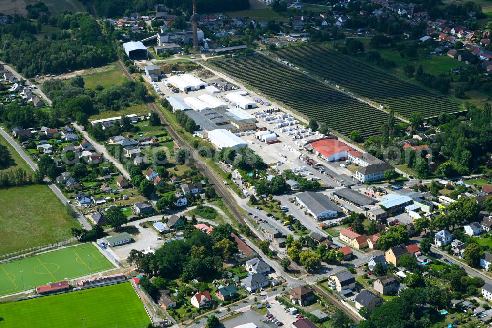 Aerial image Klosterfelde - Industrial and commercial area on the edge of agricultural fields and fields on street Beusterstrasse in Klosterfelde in the state Brandenburg, Germany