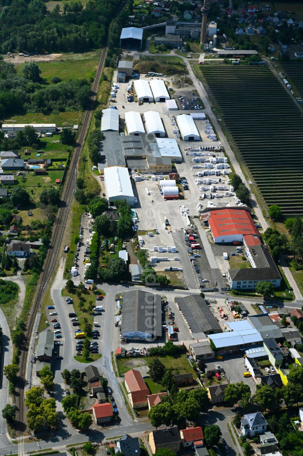 Klosterfelde from above - Industrial and commercial area on the edge of agricultural fields and fields on street Beusterstrasse in Klosterfelde in the state Brandenburg, Germany
