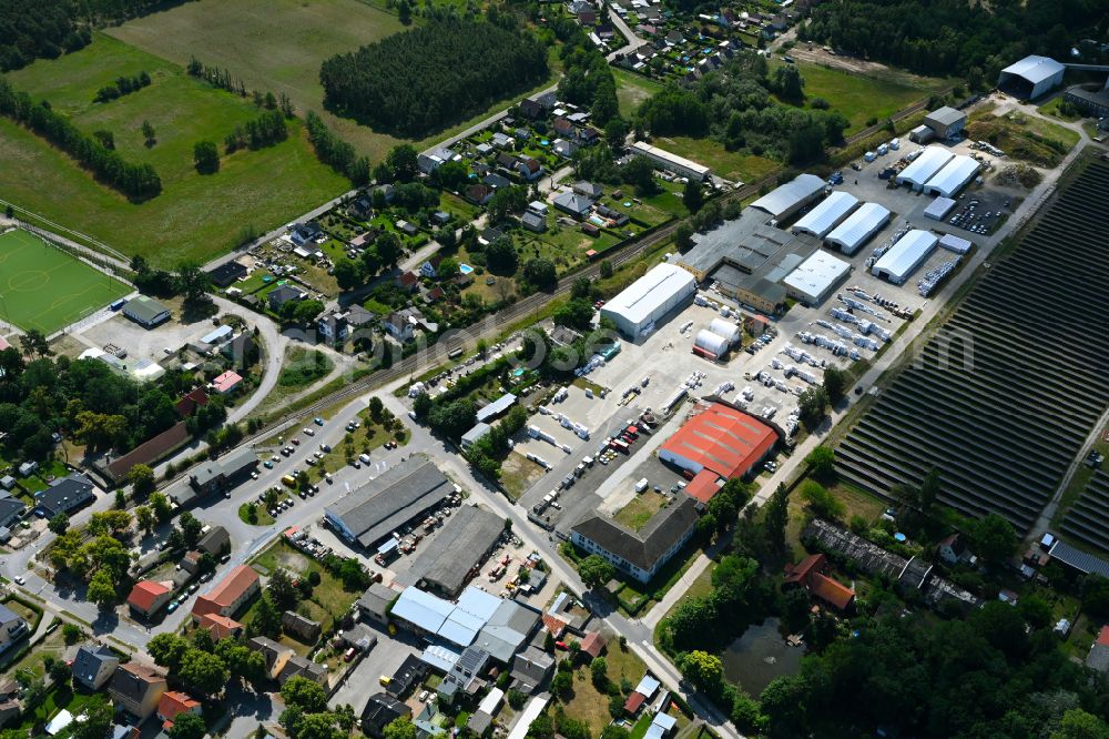 Klosterfelde from the bird's eye view: Industrial and commercial area on the edge of agricultural fields and fields on street Beusterstrasse in Klosterfelde in the state Brandenburg, Germany