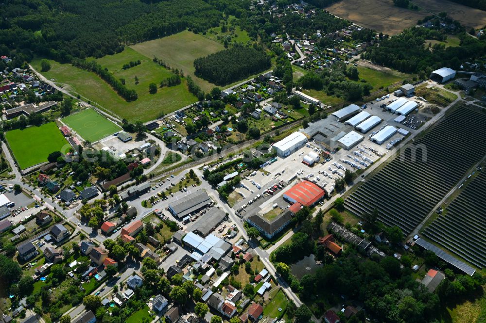Aerial image Klosterfelde - Industrial and commercial area on the edge of agricultural fields and fields on street Beusterstrasse in Klosterfelde in the state Brandenburg, Germany