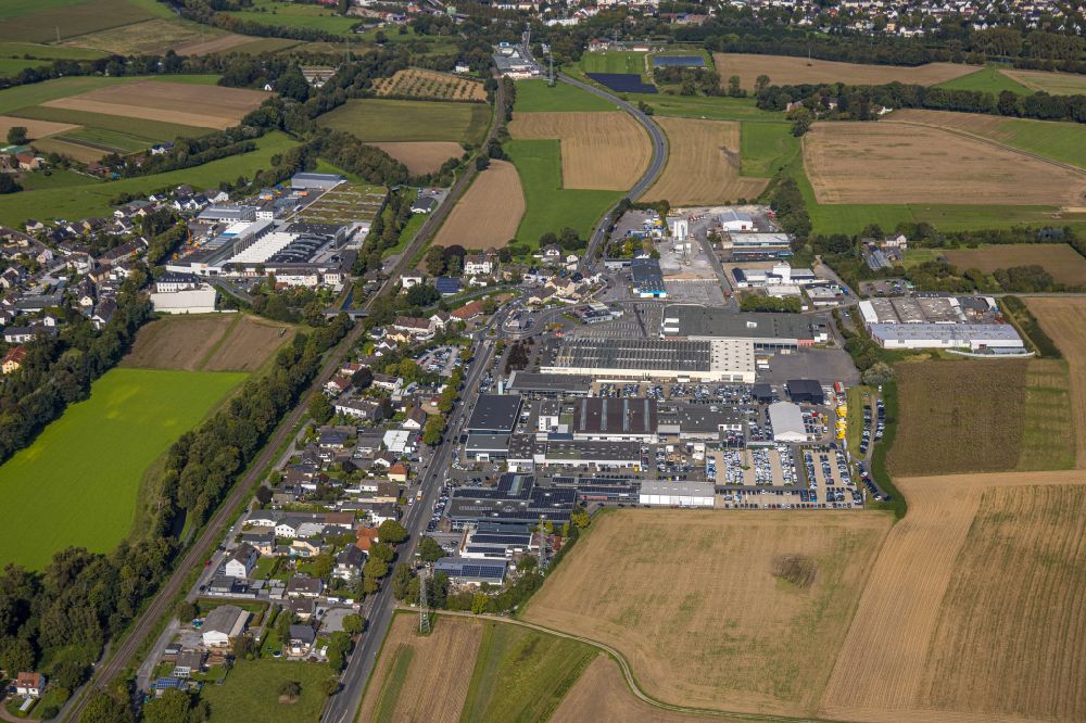 Menden (Sauerland) from above - Industrial and commercial area on the edge of agricultural fields and fields in Menden (Sauerland) in the state North Rhine-Westphalia, Germany