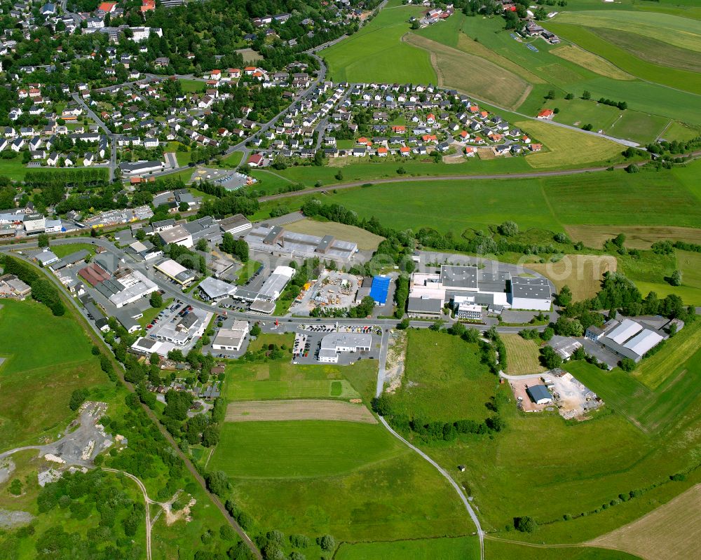 Münchberg from above - Industrial and commercial area on the edge of agricultural fields and fields in Münchberg in the state Bavaria, Germany
