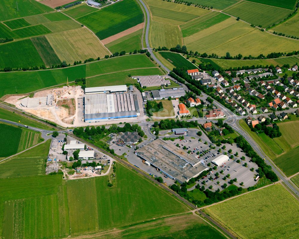 Weilheim from the bird's eye view: Industrial and commercial area on the edge of agricultural fields and fields on street Alte Landstrasse in Weilheim in the state Baden-Wuerttemberg, Germany