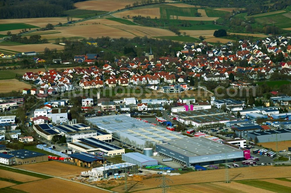 Ottmarsheim from the bird's eye view: Building complex and grounds of the logistics center Mueller - Die lila Logistik AG in Ottmarsheim in the state Baden-Wurttemberg, Germany