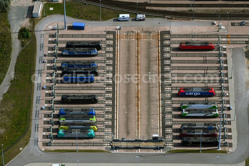 Hamburg from the bird's eye view: Locomotive service station and depot with sliding platform system and lock parking spaces of ajax Loktechnik GmbH in the district Altenwerder in Hamburg, Germany
