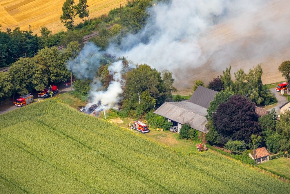 Aerial photograph Kamen - Fire fighting at the fire brigade on fire the building on Karl-Wilhelm Poth Derner Strasse in Kamen in the state North Rhine-Westphalia, Germany