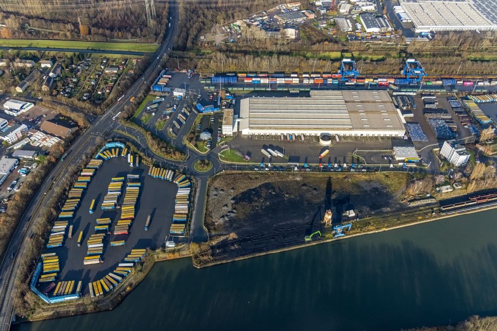 Herne from the bird's eye view: Aerial view of truck parking areas and open-air warehouse of Mueller - Die lila Logistik GmbH & Co. KG Am Westhafen and Wanne-Herner Eisenbahn und Hafen GmbH on the Rhine-Herne Canal in Herne in the federal state of North Rhine-Westphalia, Germany