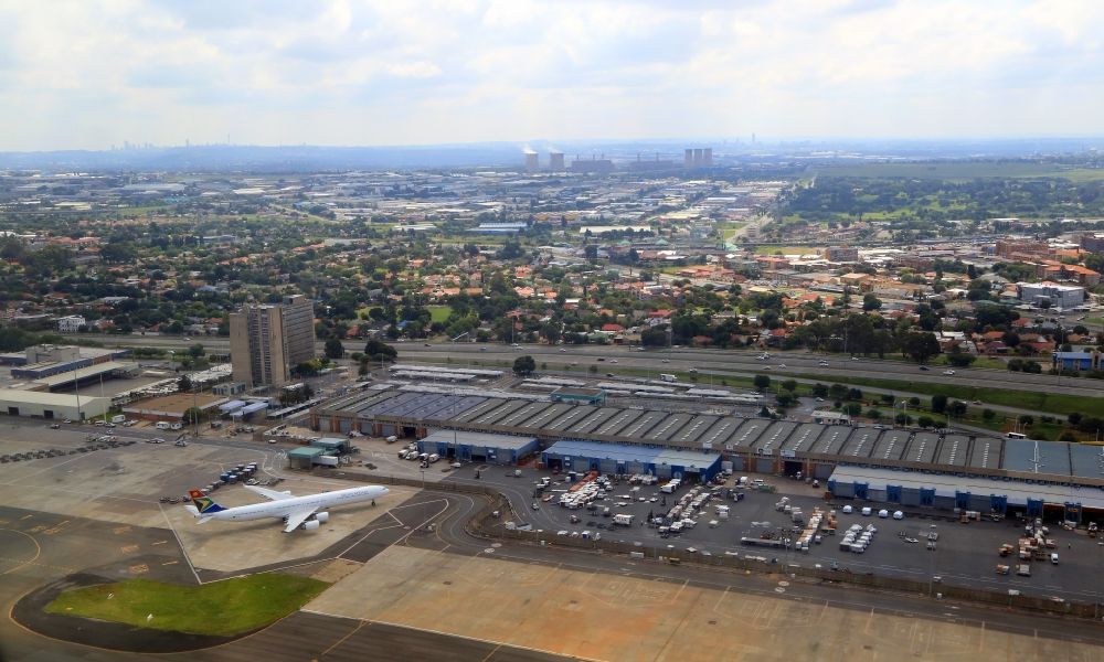 Kempton Park from above - Grounds of the airport O.R. Tambo International Airport in Johannesburg with an airliners of South African in Gauteng, South Africa