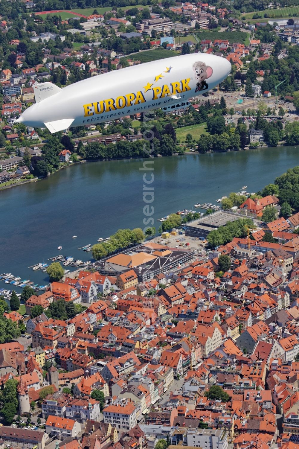 Lindau (Bodensee) from the bird's eye view: Zeppelin NT on the island of Lindau in Bavaria. The semi-rigid airship D-LZFN Friedrichshafen on a tourist flight with passengers