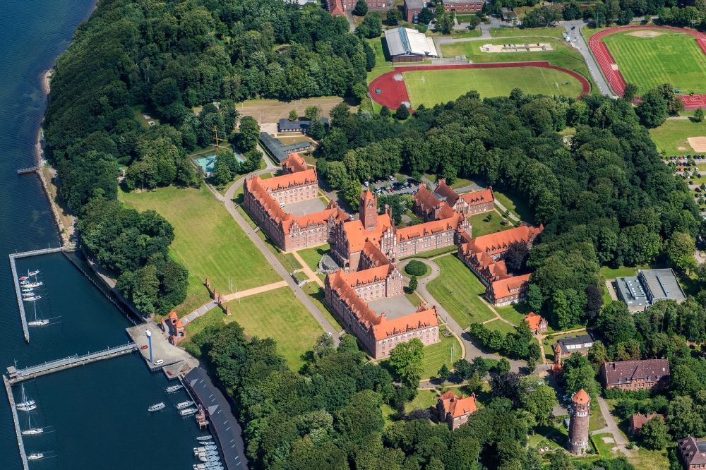 Aerial image Flensburg - The Naval School Muerwik, abbreviation MSM, is the training center for officers and officer candidates of the navy with its subordinate sailing training ship Gorch Fock. In the district of Flensburg-Muerwik, the foundation stone was laid in 1907 for the building erected according to the generous plans of the Naval Building Authority Kelm. The external design of the MSM, which is also called the Red Castle on the sea, is very similar to the historic buildings of the East Prussian Marienburg of the Teutonic Knights
