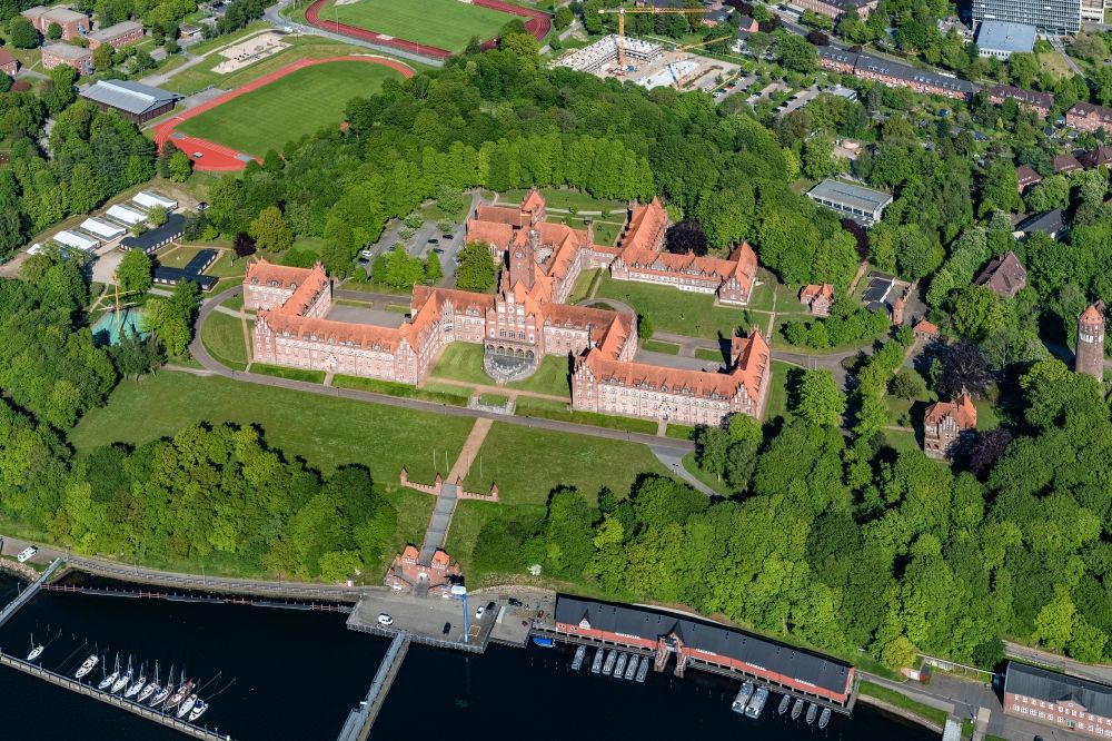 Aerial image Flensburg - The Naval School Muerwik, abbreviation MSM, is the training center for officers and officer candidates of the navy with its subordinate sailing training ship Gorch Fock. In the district of Flensburg-Muerwik, the foundation stone was laid in 1907 for the building erected according to the generous plans of the Naval Building Authority Kelm. The external design of the MSM, which is also called the Red Castle on the sea, is very similar to the historic buildings of the East Prussian Marienburg of the Teutonic Knights
