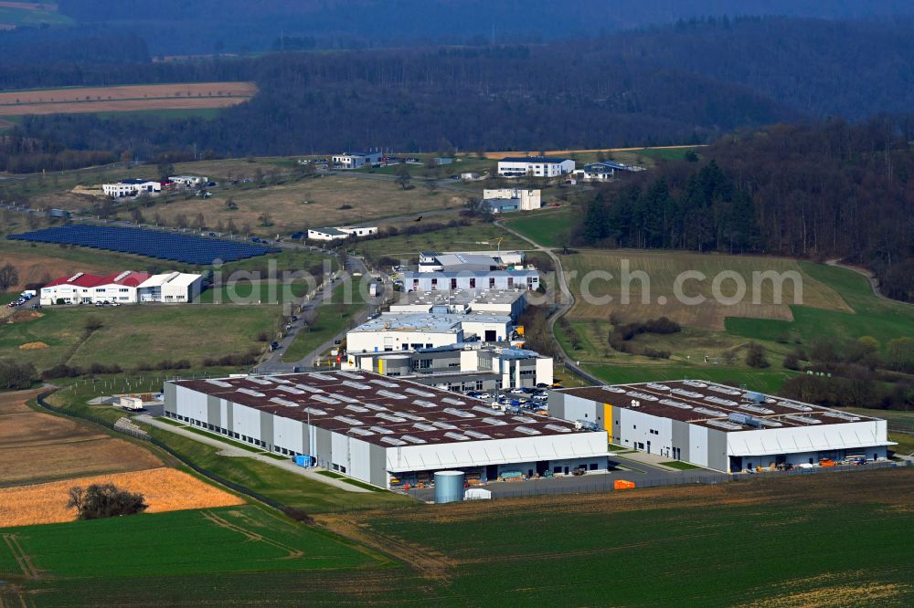 Obrigheim from above - Buildings and production halls on the site of the mechanical engineering company of Interroll Conveyor GmbH on street Kraichgaublick in Obrigheim in the state Baden-Wuerttemberg, Germany