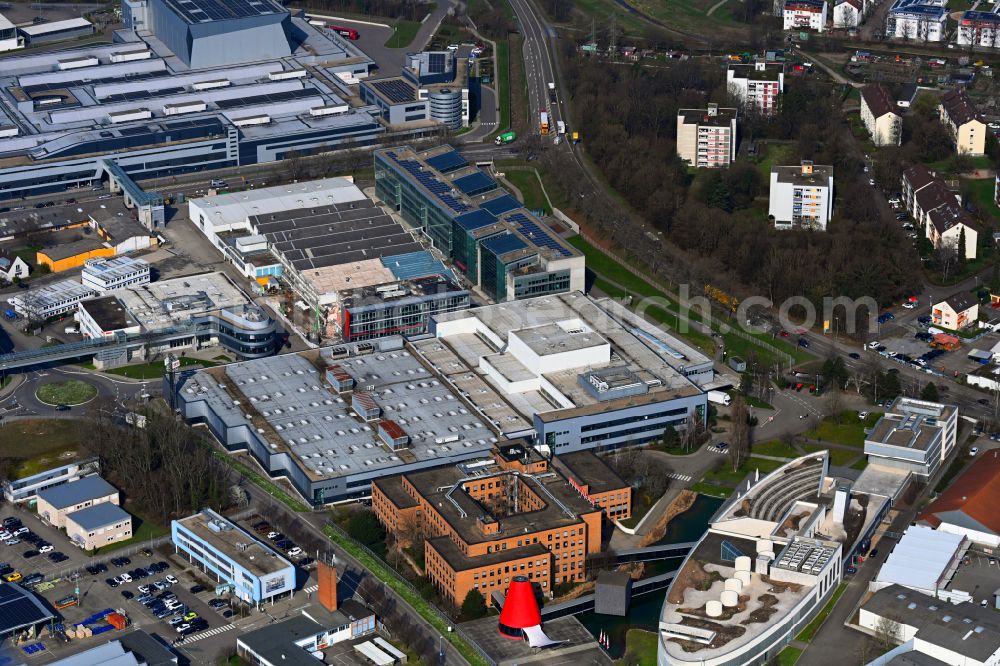 Aerial photograph Bruchsal - Buildings and production halls on the site of the mechanical engineering company of SEW-EURODRIVE GmbH & Co KG on street Ernst-Blickle-Strasse in the district Untergrombach in Bruchsal in the state Baden-Wuerttemberg, Germany