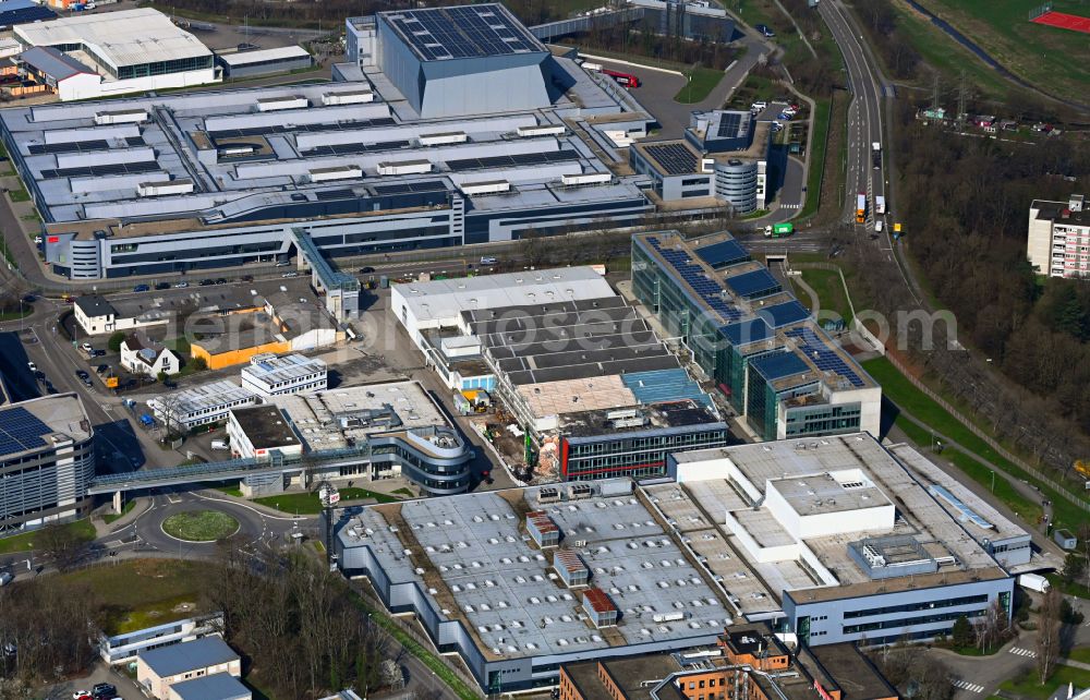 Bruchsal from above - Buildings and production halls on the site of the mechanical engineering company of SEW-EURODRIVE GmbH & Co KG on street Ernst-Blickle-Strasse in the district Untergrombach in Bruchsal in the state Baden-Wuerttemberg, Germany