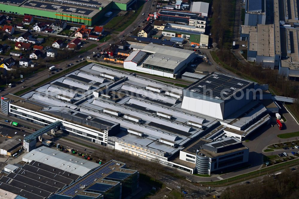 Bruchsal from the bird's eye view: Buildings and production halls on the site of the mechanical engineering company of SEW-EURODRIVE GmbH & Co KG on street Ernst-Blickle-Strasse in the district Untergrombach in Bruchsal in the state Baden-Wuerttemberg, Germany