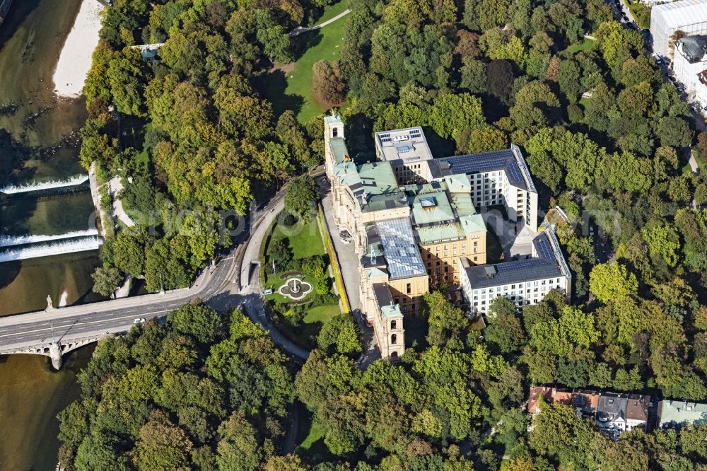 München from above - The Maximilianeum in Munich Haidhausen in the state of Bavaria. The historic building on the Isar-Hochufer at Maximiliansbruecke is home to the Maximilianeum Foundation and is the seat of the Bavarian State Parliament