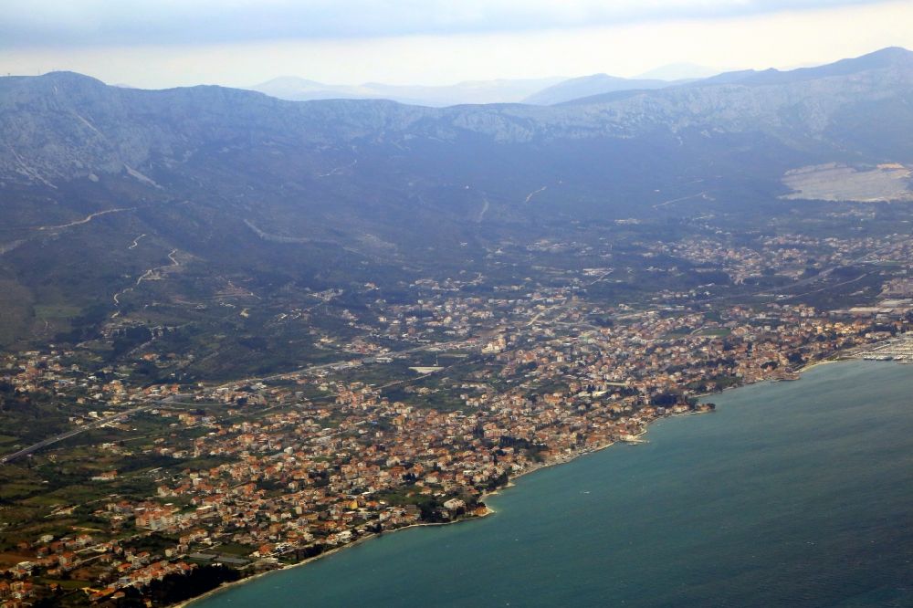 Aerial image Kastel Luksi? - Saside at the Adriatic Sea at Kastel Luksic, Kastel Kambelovac and Kastel Gomilica in Splitsko-dalmatinska zupanija, Croatia