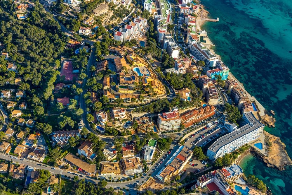 Rotes Velles from the bird's eye view: Townscape on the seacoast overlooking the holiday house plant and the promenade of the Carrer de Ramon de Montcada in Rotes Velles in Balearic island of Mallorca, Spain