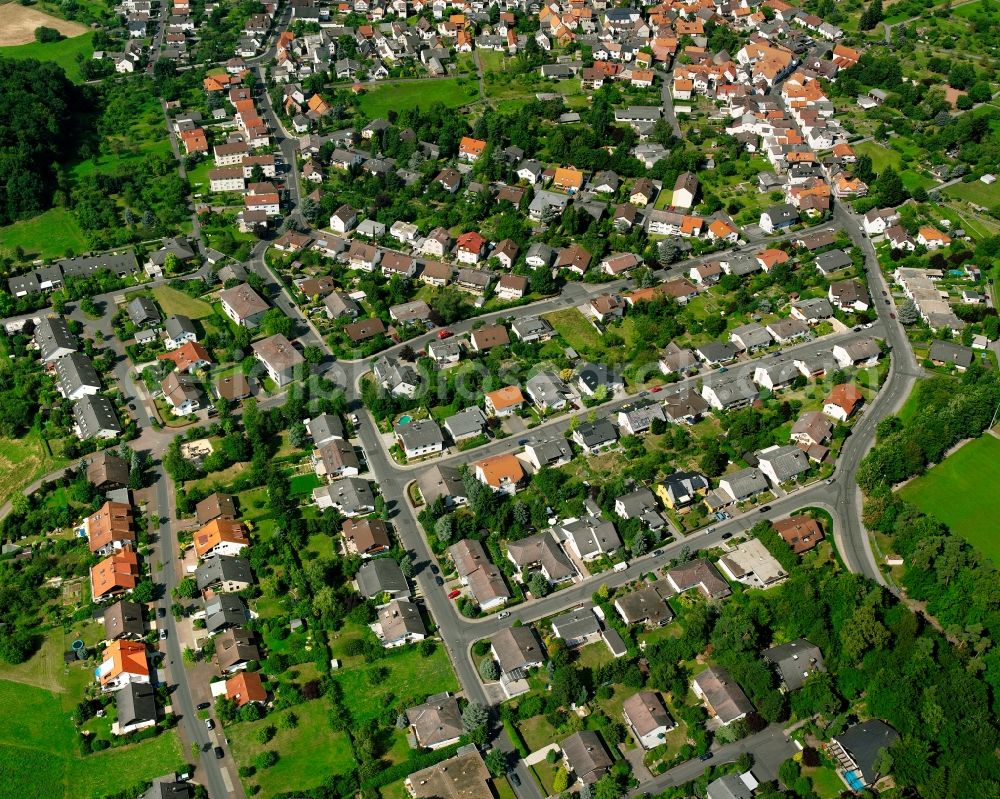 Rödgen from the bird's eye view: Residential area of a multi-family house settlement in Rödgen in the state Hesse, Germany
