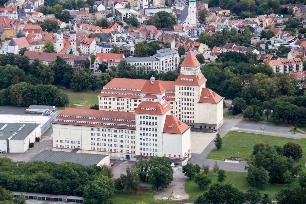 Aerial photograph Wurzen - The mill works on the mill race is an industrial monument, built between 1917 until 1925. The building is located in Wurzen in Saxony. The towers of the mill works are the landmarks of the city. Now home to the Wurzener Nahrungsmittel GmbH