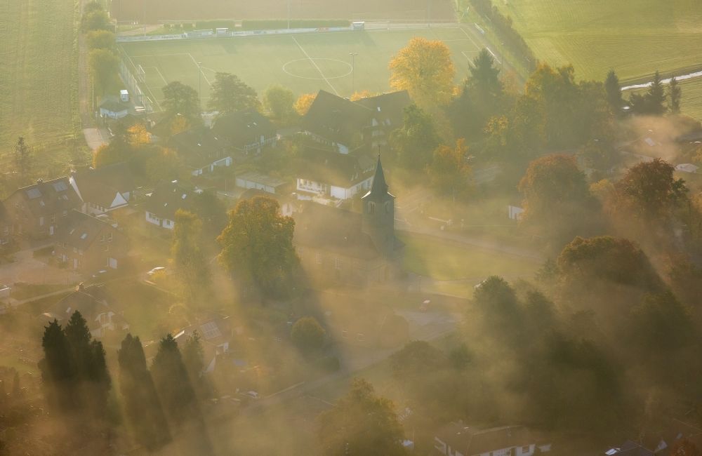 Mintard from the bird's eye view: Mintard in the valley of the river Ruhr after sunrise in fog in the state of North Rhine-Westphalia
