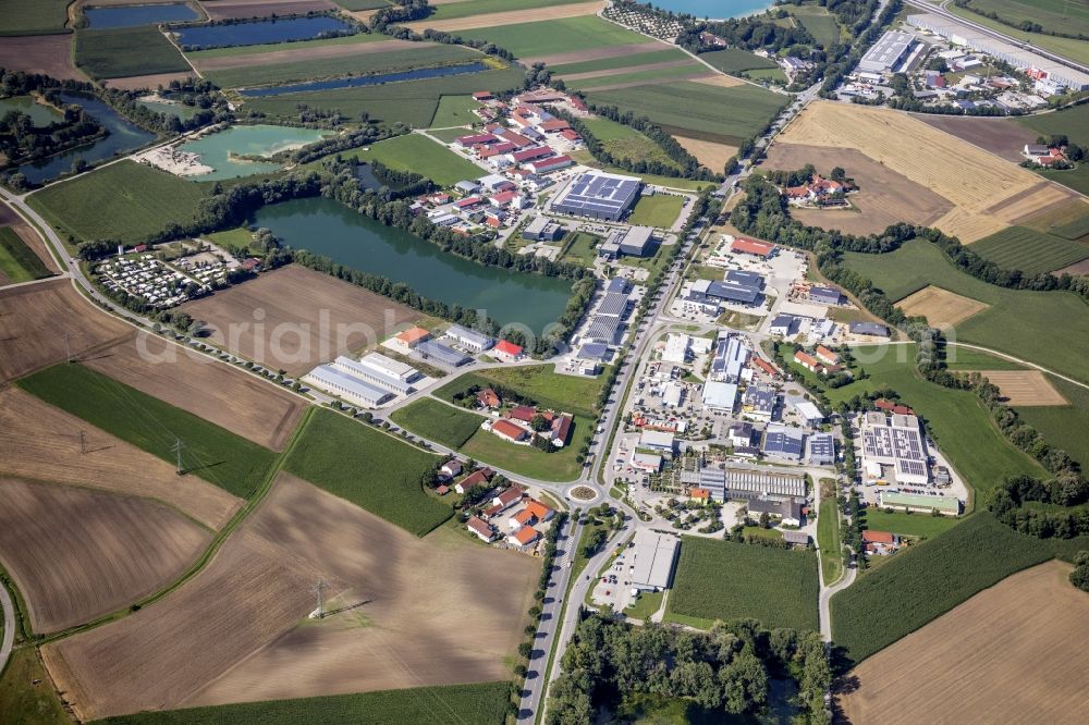 Haselfurth from above - Mixed development of the residential and commercial area with bathing lake in Haselfurth in the state Bavaria, Germany