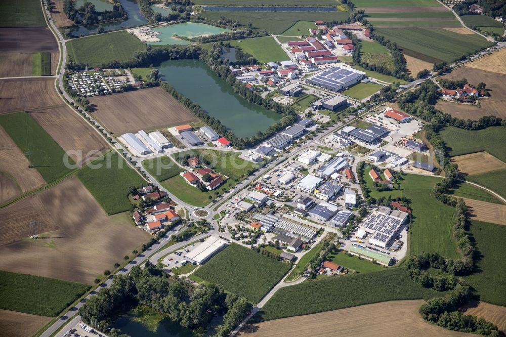 Haselfurth from the bird's eye view: Mixed development of the residential and commercial area with bathing lake in Haselfurth in the state Bavaria, Germany