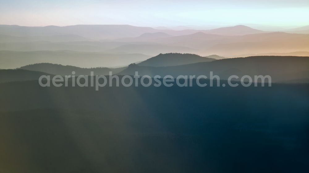 Oberhof from above - Forest and mountain landscape of the mid-mountain range in the morning mist in Oberhof at Thueringer Wald in the state Thuringia, Germany