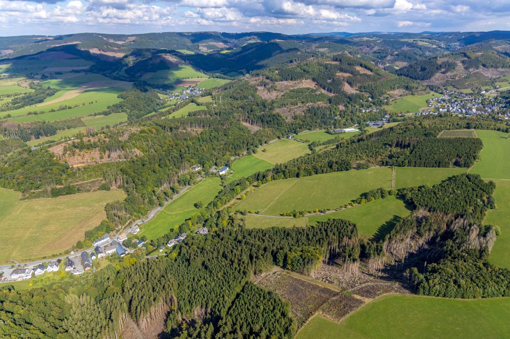Schmallenberg from the bird's eye view: Forest and mountain landscape of the mid-mountain range on street Am Langen Hagen in the district Winkhausen in Schmallenberg at Sauerland in the state North Rhine-Westphalia, Germany