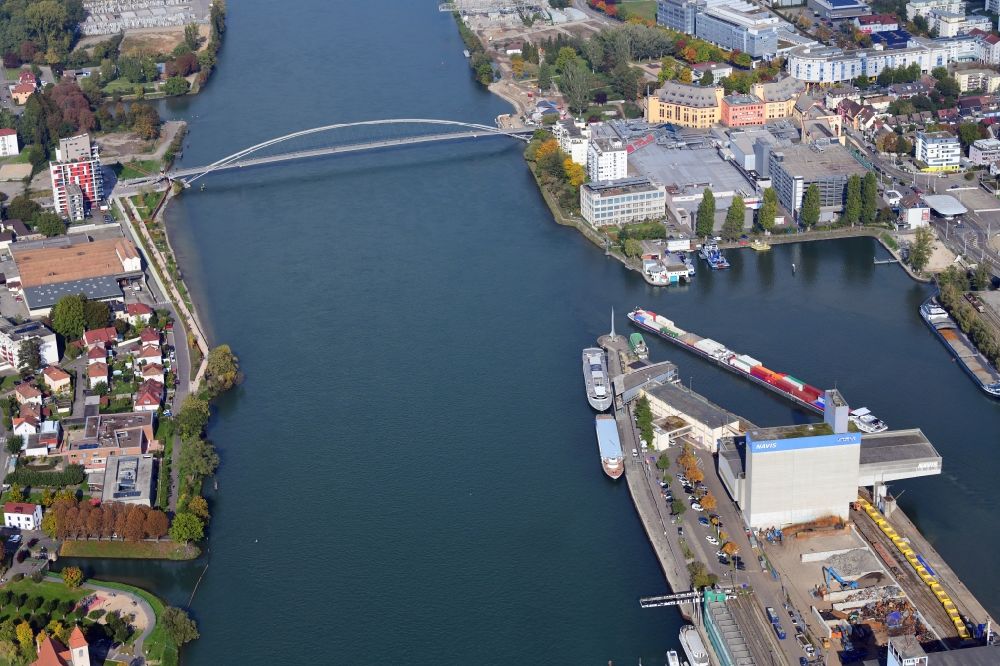 Aerial photograph Basel - In the middle of the river Rhine the three countries Germany, Switzerland and France merge in Basel in Switzerland. A Pylon is symbolising the location in the harbor area of Basle in Switzerland