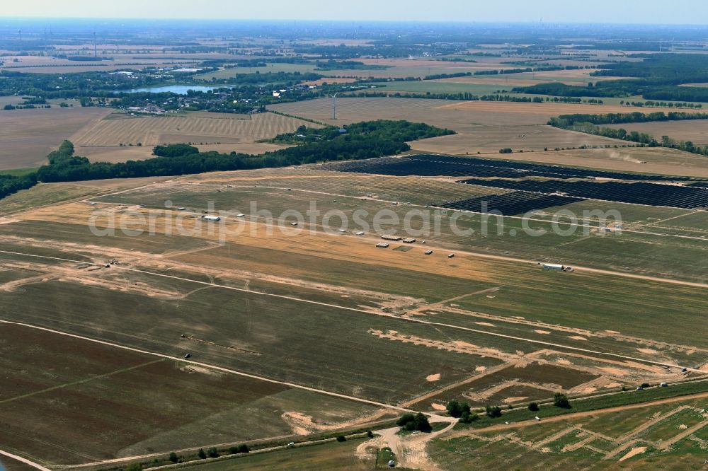 Willmersdorf from the bird's eye view: Construction site and assembly work for solar park and solar power plant Solarpark Weesow-Willmersdorf in Willmersdorf in the state Brandenburg, Germany