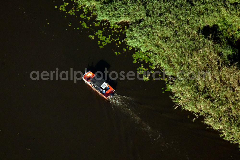 Aerial photograph Mirow - Motorboat in motion on Zotzensee in Mirow in the state Mecklenburg - Western Pomerania, Germany