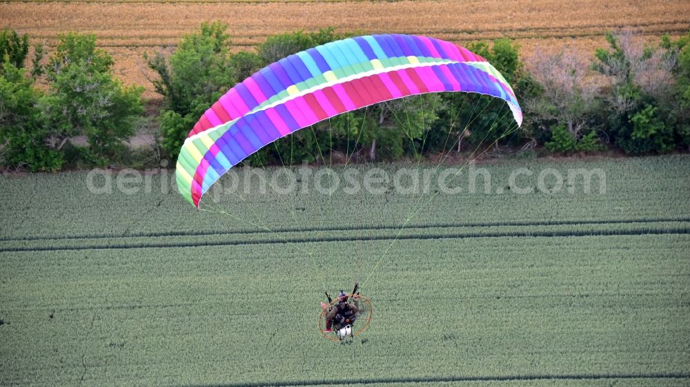 Ballenstedt from the bird's eye view: Motorized paraglider in flight in the state Saxony-Anhalt, Germany