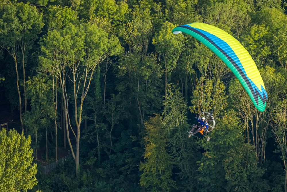 Aerial image Werl - Motorized paraglider in flight over the airspace over a forest area in Werl at Ruhrgebiet in the state North Rhine-Westphalia, Germany