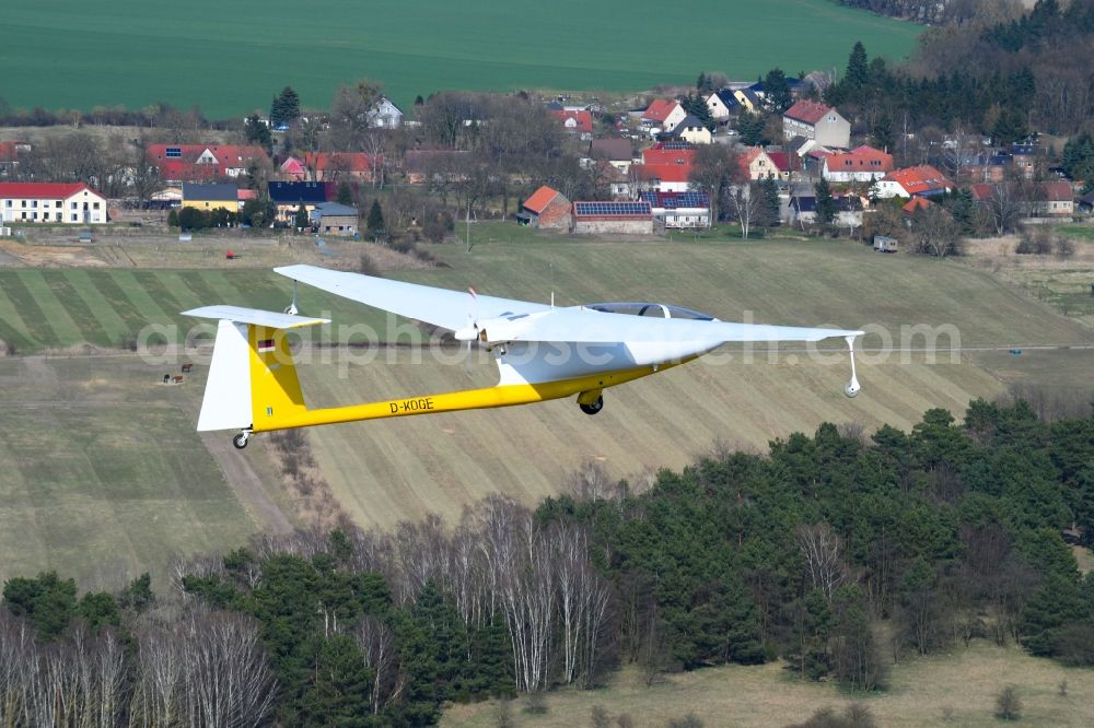 Aerial photograph Hirschfelde - Glider and sport aircraft - Motorglider Ogar with the registration D-KOGE flying over the airspace in Hirschfelde in the state Brandenburg, Germany
