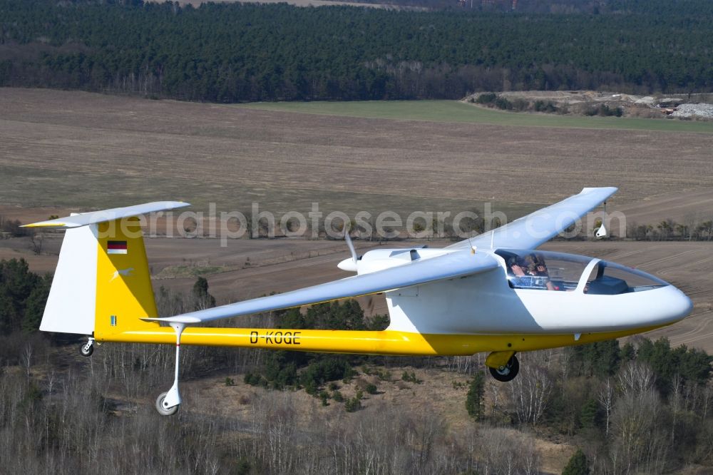 Aerial image Hirschfelde - Glider and sport aircraft - Motorglider Ogar with the registration D-KOGE flying over the airspace in Hirschfelde in the state Brandenburg, Germany