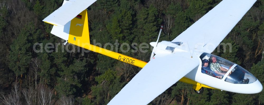 Aerial image Hirschfelde - Glider and sport aircraft - Motorglider Ogar with the registration D-KOGE flying over the airspace in Hirschfelde in the state Brandenburg, Germany