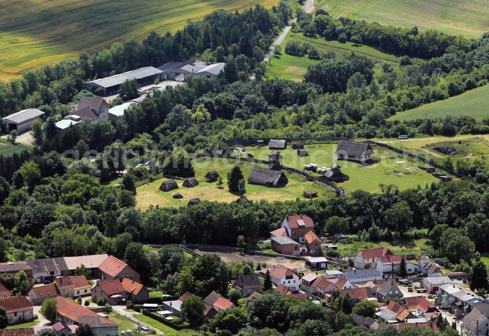 Aerial photograph Greußen - View of the archeological outdoor museum Freilichtmuseum Funkenburg in the street Dorfstrasse in Greussen in the state of Thuringia. It houses the only German reconstruction of a Germanic military settlement