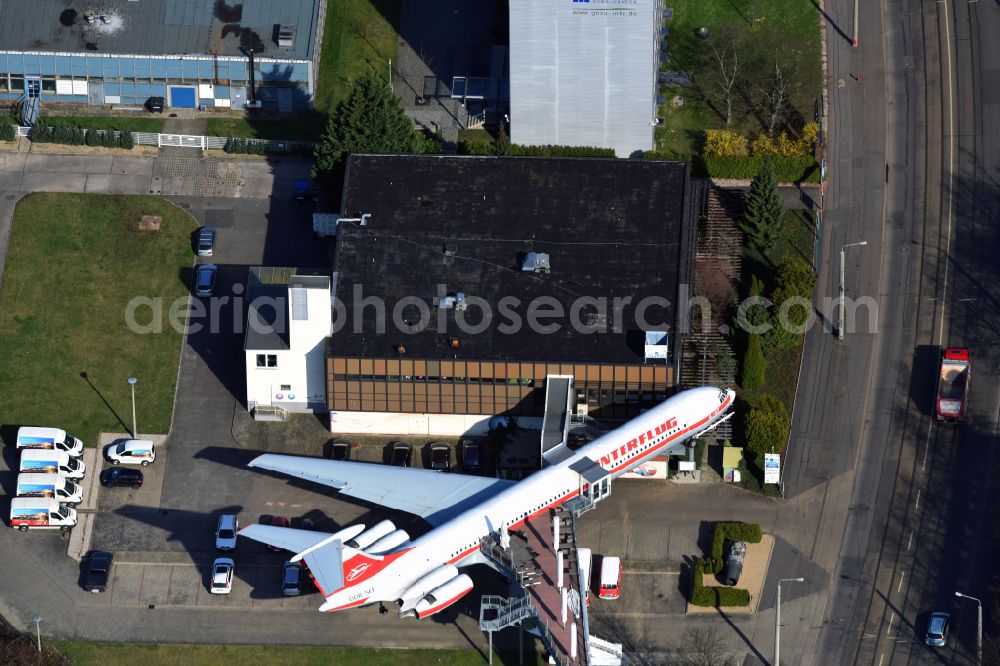 Leipzig from above - Discarded Ilyushin IL-62 passenger aircraft of the former GDR - airline INTERFLUG as an aircraft with the registration DDR-SEF - used as a museum building ensemble and restaurant on Arno-Nitzsche-Strasse in the southern part of the city Leipzig in the state of Saxony, Germany