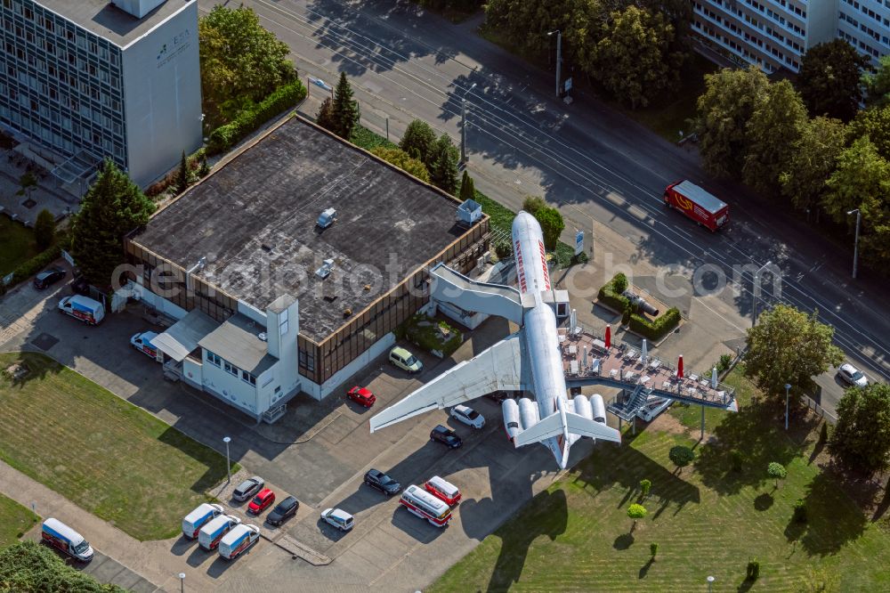 Leipzig from above - Discarded Ilyushin IL-62 passenger aircraft of the former GDR - airline INTERFLUG as an aircraft with the registration DDR-SEF - used as a museum building ensemble and restaurant on Arno-Nitzsche-Strasse in the southern part of the city Leipzig in the state of Saxony, Germany