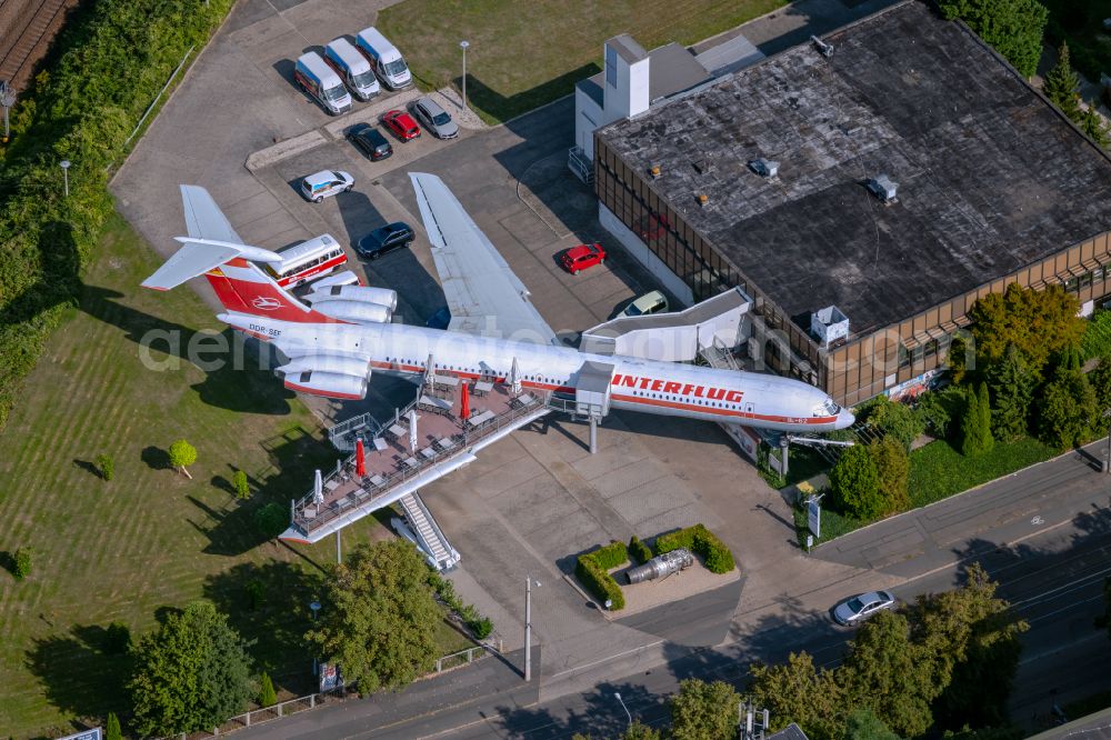 Leipzig from the bird's eye view: Discarded Ilyushin IL-62 passenger aircraft of the former GDR - airline INTERFLUG as an aircraft with the registration DDR-SEF - used as a museum building ensemble and restaurant on Arno-Nitzsche-Strasse in the southern part of the city Leipzig in the state of Saxony, Germany