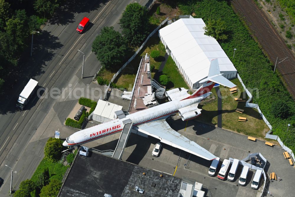 Aerial image Leipzig - Discarded Ilyushin IL-62 passenger aircraft of the former GDR - airline INTERFLUG as an aircraft with the registration DDR-SEF - used as a museum building ensemble and restaurant on Arno-Nitzsche-Strasse in the southern part of the city Leipzig in the state of Saxony, Germany