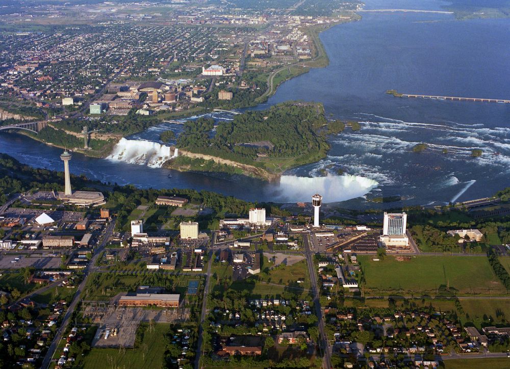 Niagara Falls from above - Natural spectacle of the Niagara Falls on Niagara River on street Niagara River Parkway in Niagara Falls in Ontario, Canada. The larger Horseshoe Falls in Canada and the American Falls in the United States