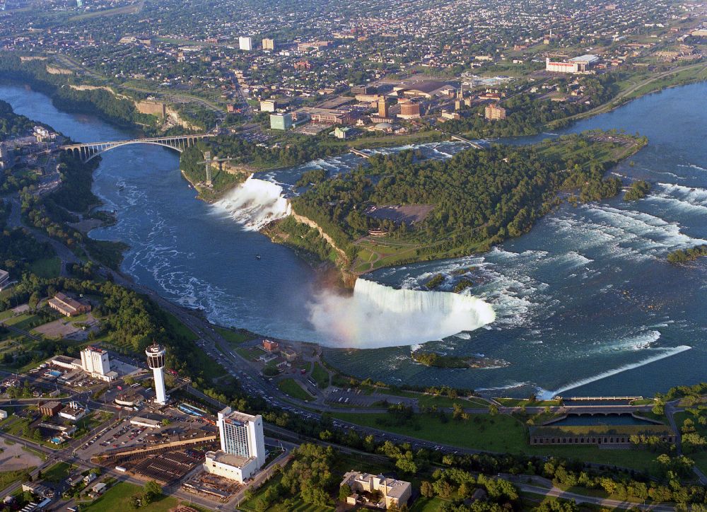 Aerial image Niagara Falls - Natural spectacle of the Niagara Falls on Niagara River on street Niagara River Parkway in Niagara Falls in Ontario, Canada. The larger Horseshoe Falls in Canada and the American Falls in the United States