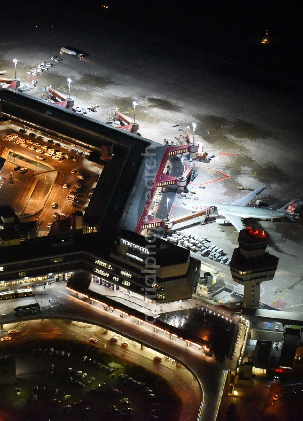 Berlin from above - Night flight operations at the terminal of the airport Berlin - Tegel