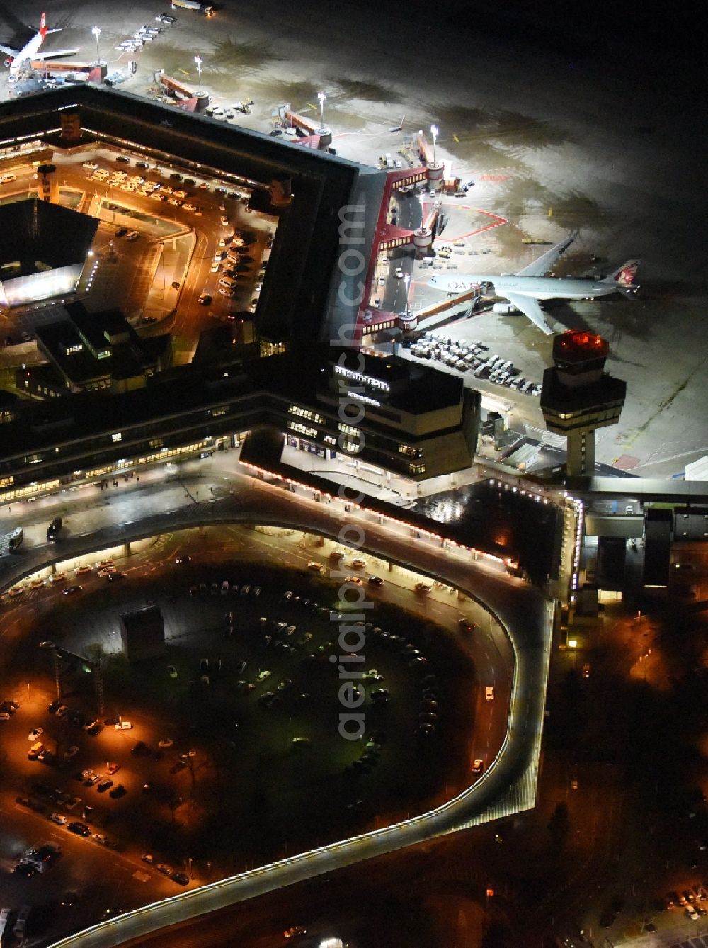 Berlin from the bird's eye view: Night flight operations at the terminal of the airport Berlin - Tegel