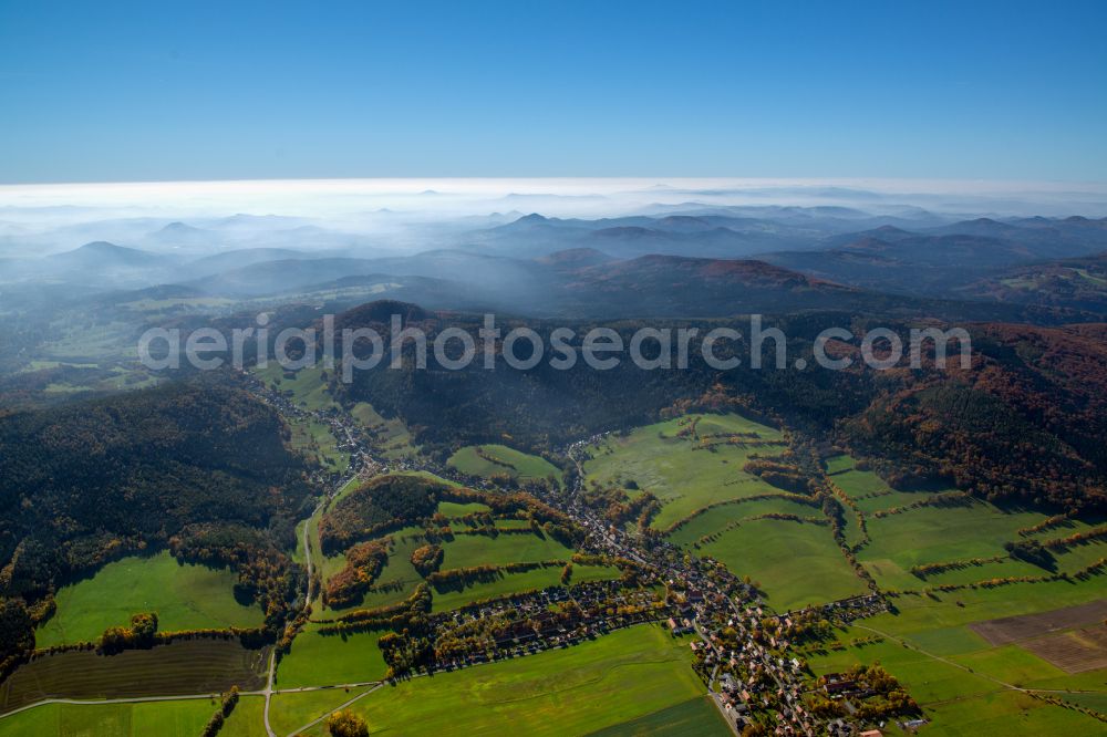 Waltersdorf from above - Weather related fog banks and cloud layer over a forest area in Waltersdorf in the state Saxony, Germany