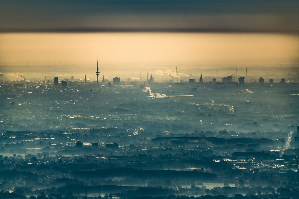 Hamburg from above - Weather related fog banks and cloud layer ueber of skyline ( Panorama) in Hamburg, Germany